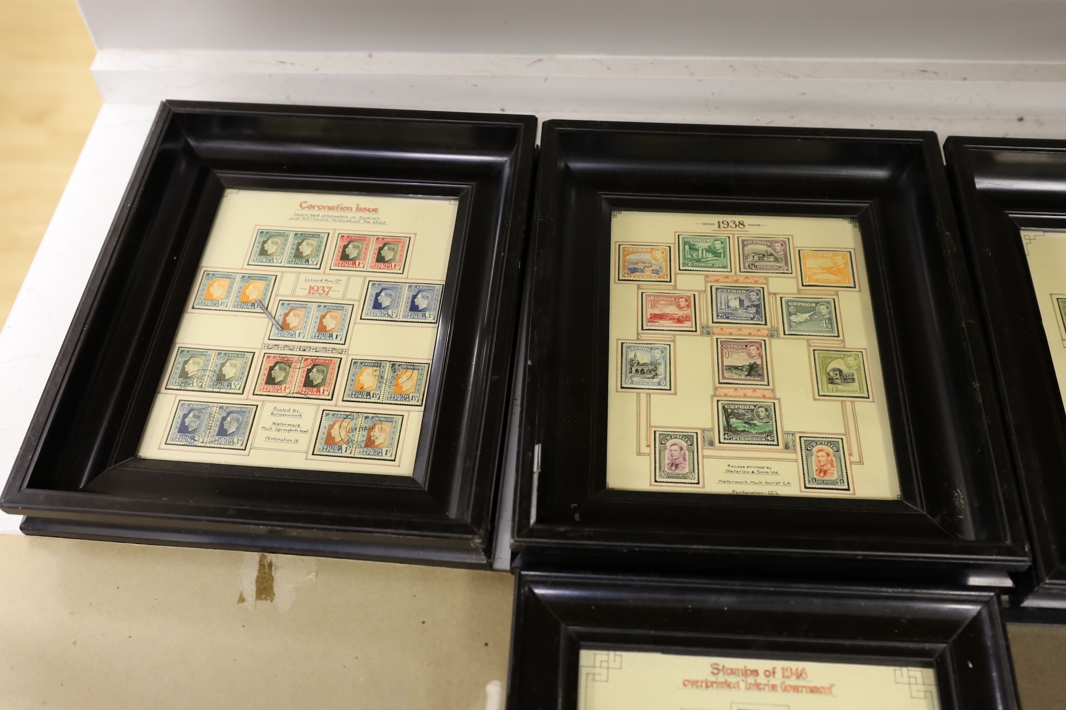 A collection of framed 1980's commemorative stamps, together with full sheets Guernsey, North Ireland and Scotland